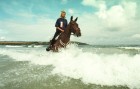 Gill Smedley and Charlie at Harlyn Bay in Cornwall training for the European Endurance Riding Championship.